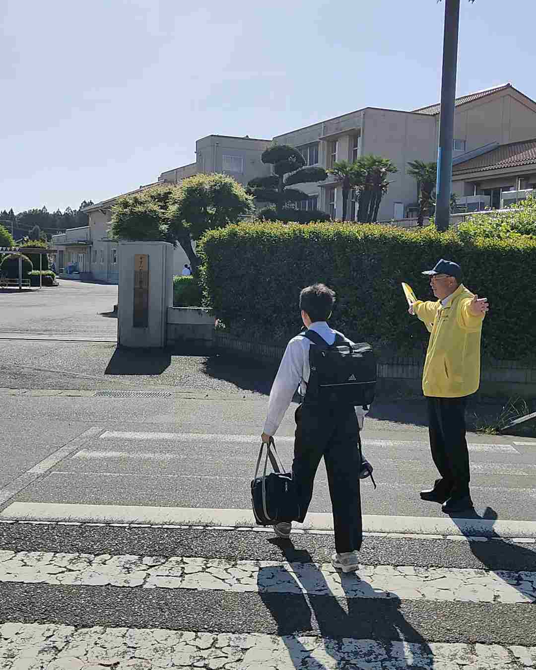 写真:全天候毎日、登校立哨12年目